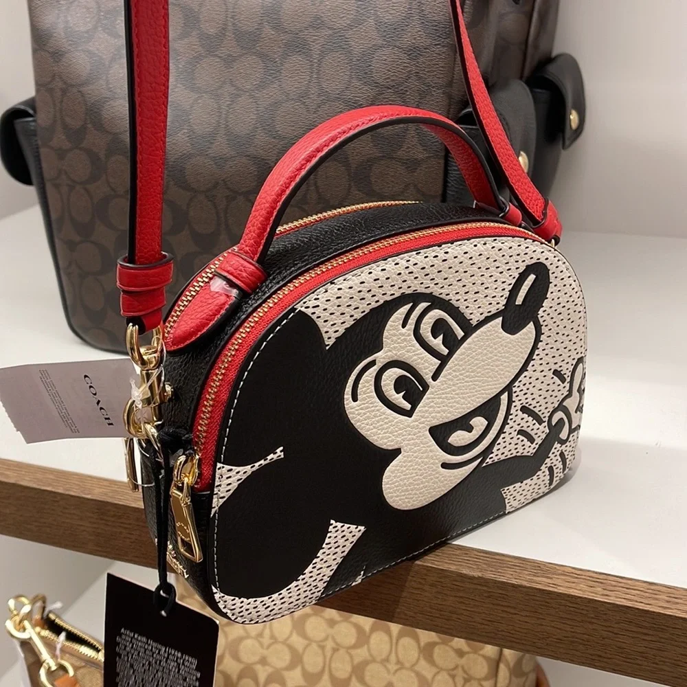 Coach Disney Mickey Mouse X Keith Haring Serena Satchel
Gold/Chalk Multi